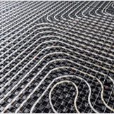 Black underfloor heating posed in a underconstruction building